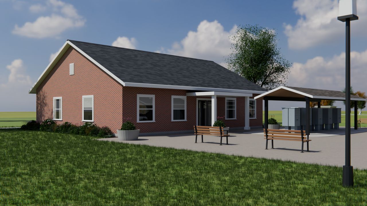 Concept render of a brick community building beside a covered pavilion and a paved plaza.