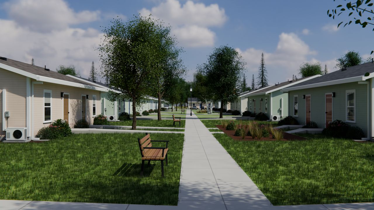 Concept render of a small green lined with one-story homes, with a path across the lawn.