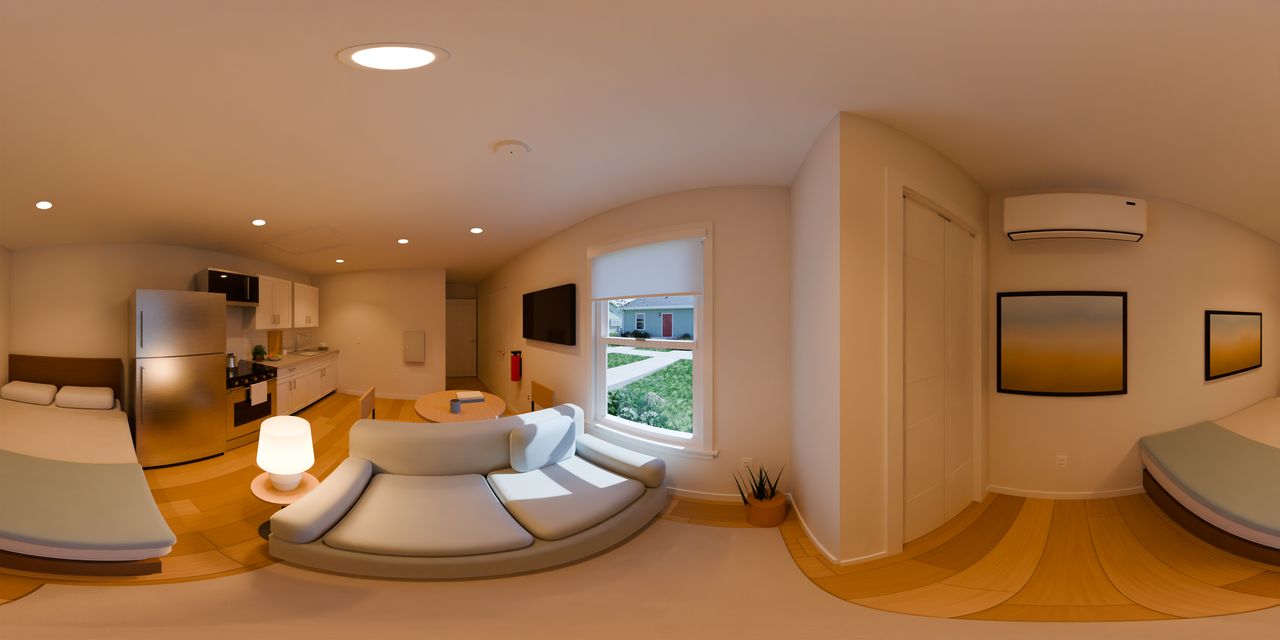 The front window looks out on a lawn and other concept homes. Beside it is the closet door, and the indoor unit of the heat pump hangs high on the end wall above a framed print, with the bed in the corner.