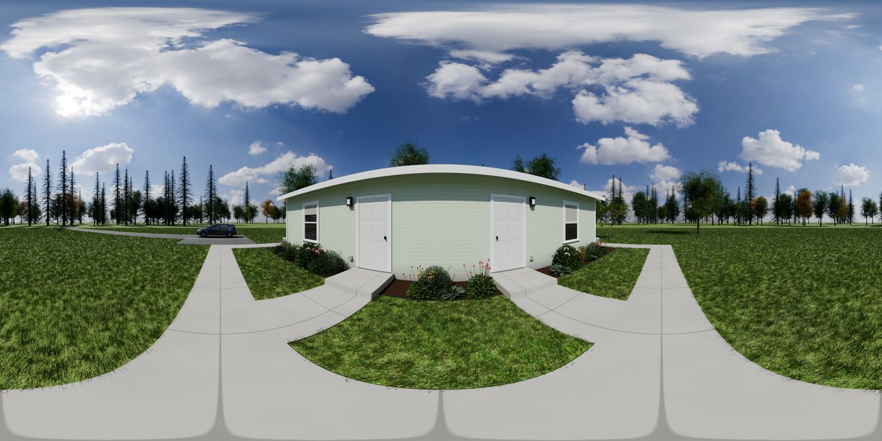 The one-story 2-plex from its front walk, with an entry door for each studio, on its own lawn.